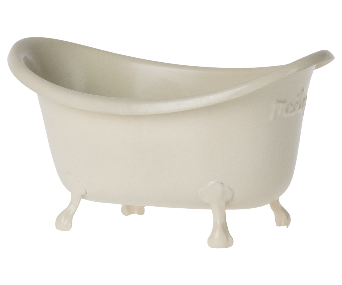 Small white bathtub with feet on a white background