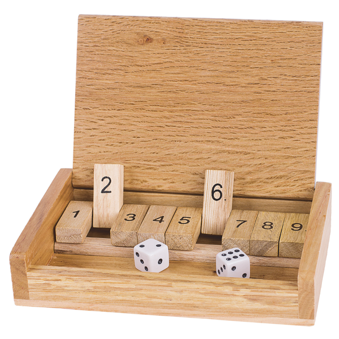 Wooden dice game set with numbered blocks and two dice on a white background